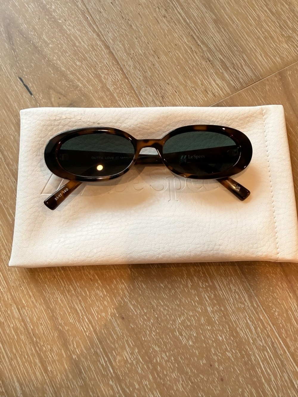 Le Specs Oval Sunglasses in Dark Tortoiseshell and Black Lenses